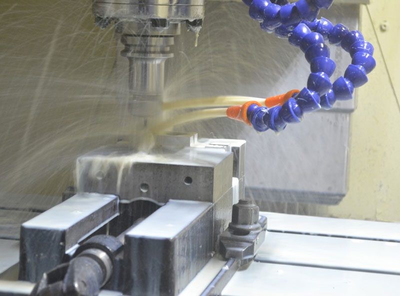 A high-tech CMM (Coordinate Measuring Machine) in a Chinese CNC facility measuring a complex metal part to ensure consistent quality and tight tolerances